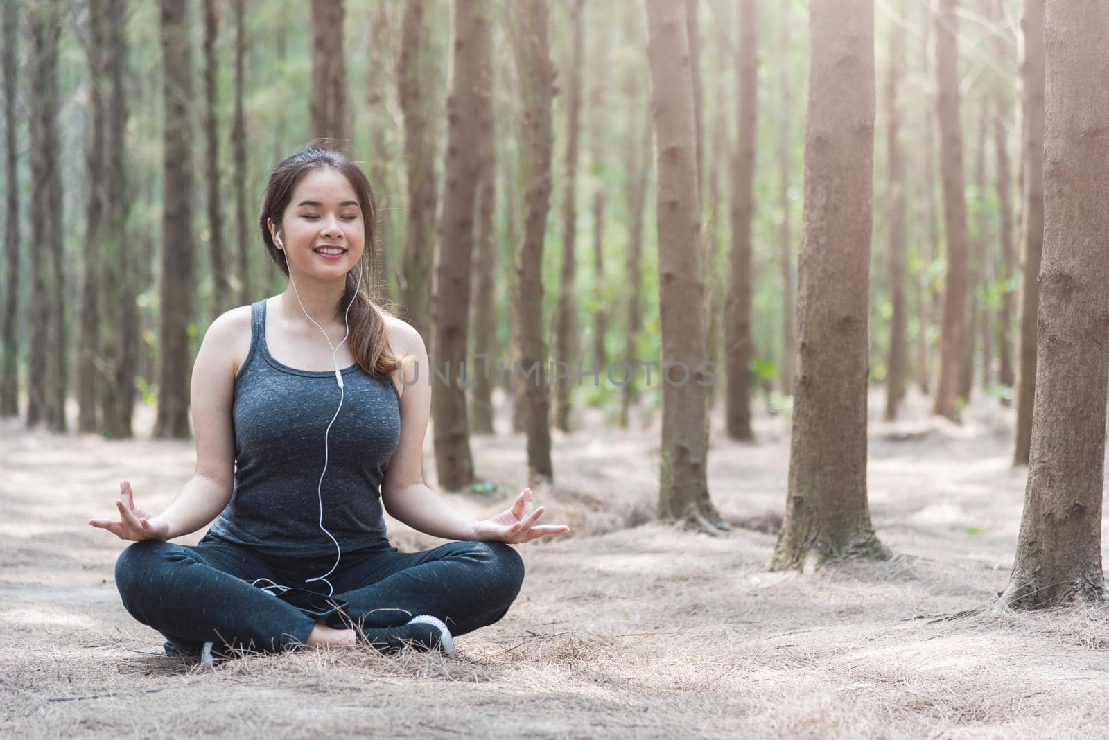 Young woman lifestyle relax sitting meditation yoga in morning at forest nature