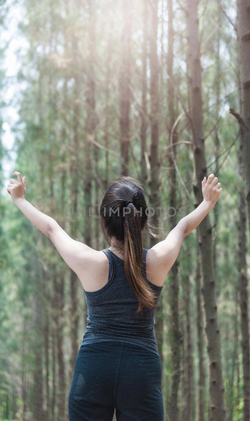 Beautiful young woman lifestyle fresh air happy relaxing in forest park