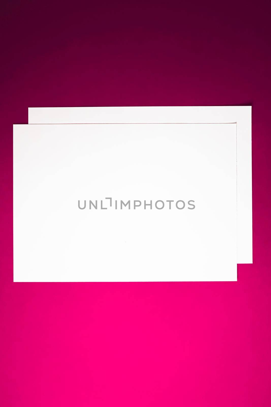 Blank A4 paper, white on pink background as office stationery flatlay, luxury branding flat lay and brand identity design for mockup.