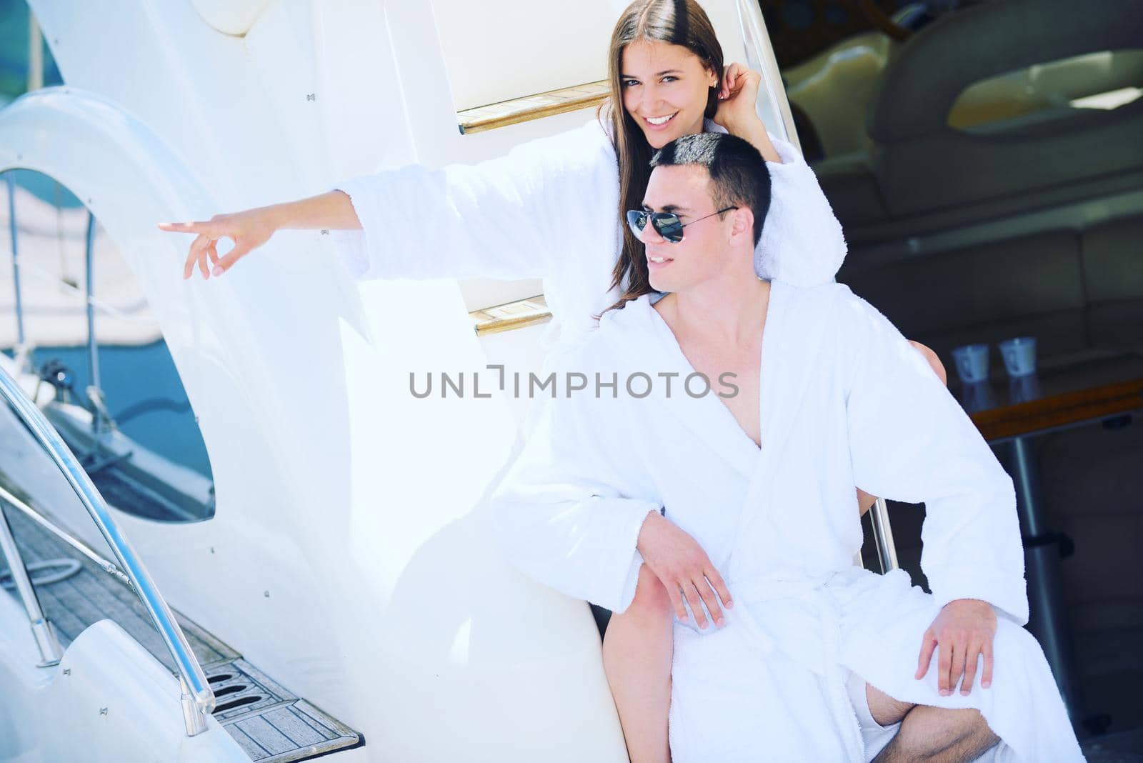 young couple on yacht by dotshock