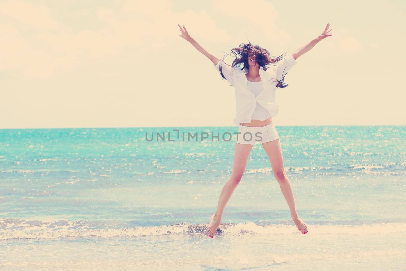 beautifel and happy woman girl on beach have fun and relax on summer vacation  over the beautiful tropical sea