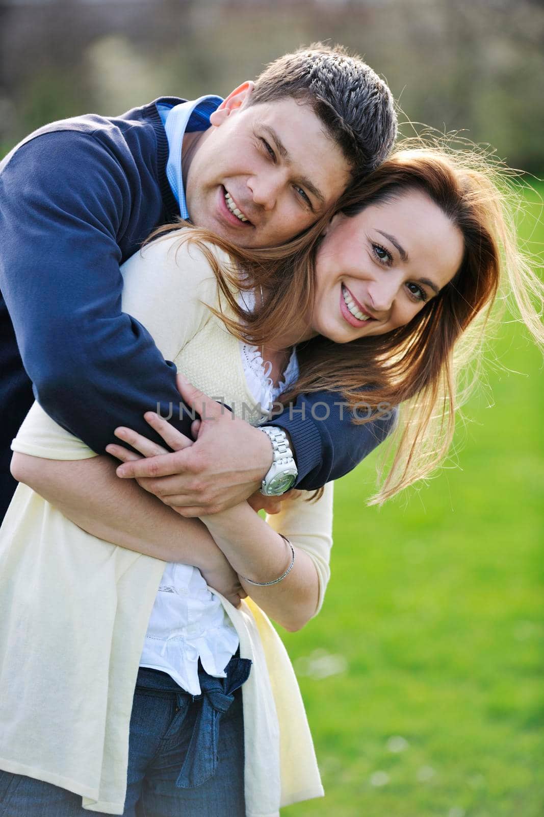 happy young couple have good time and fun outdoor at beautiful sunny day