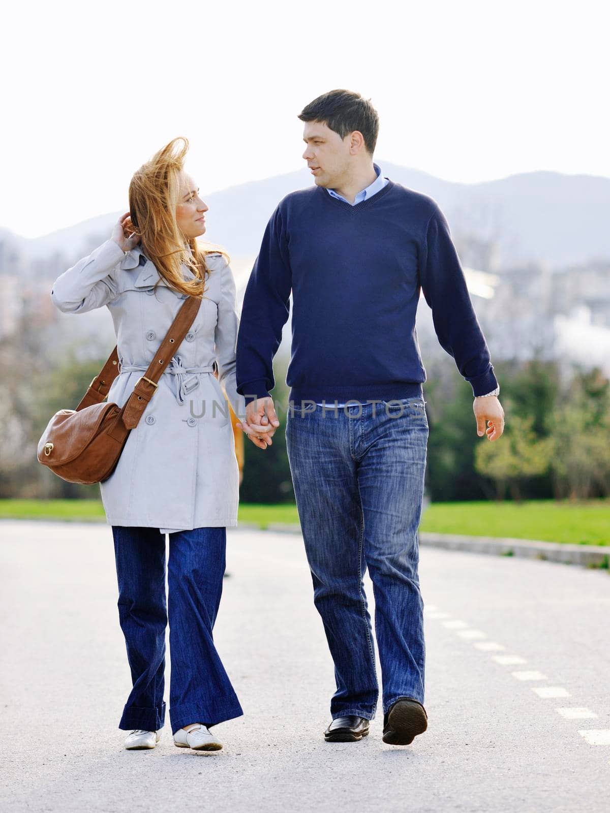 happy young couple have good time and fun outdoor at beautiful sunny day