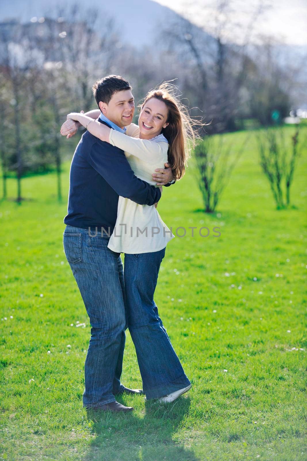 happy young couple have good time and fun outdoor at beautiful sunny day