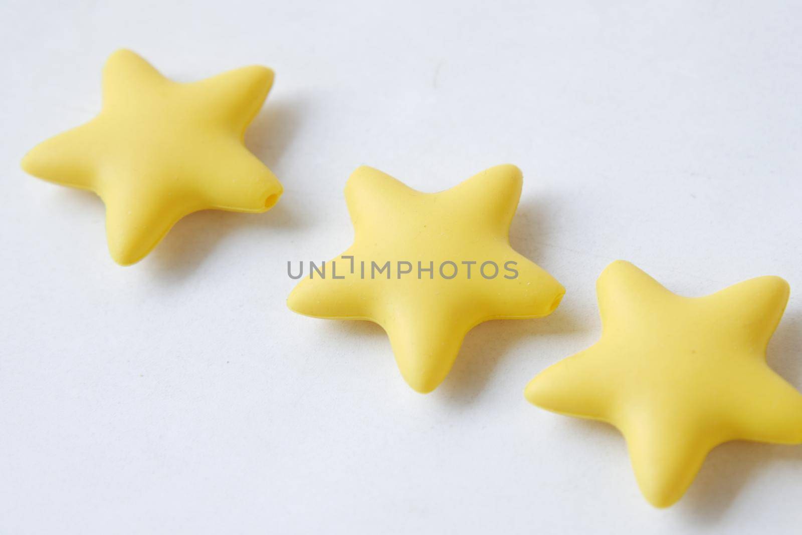 Customer review concept. Rating golden stars on blue background .