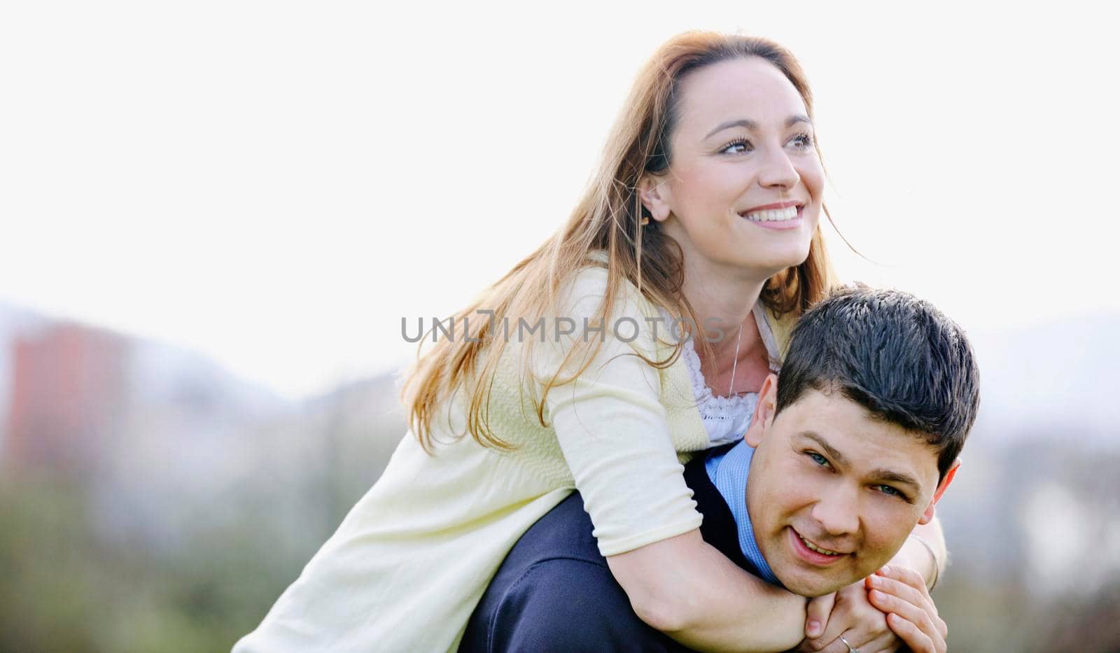 happy young couple have good time and fun outdoor at beautiful sunny day