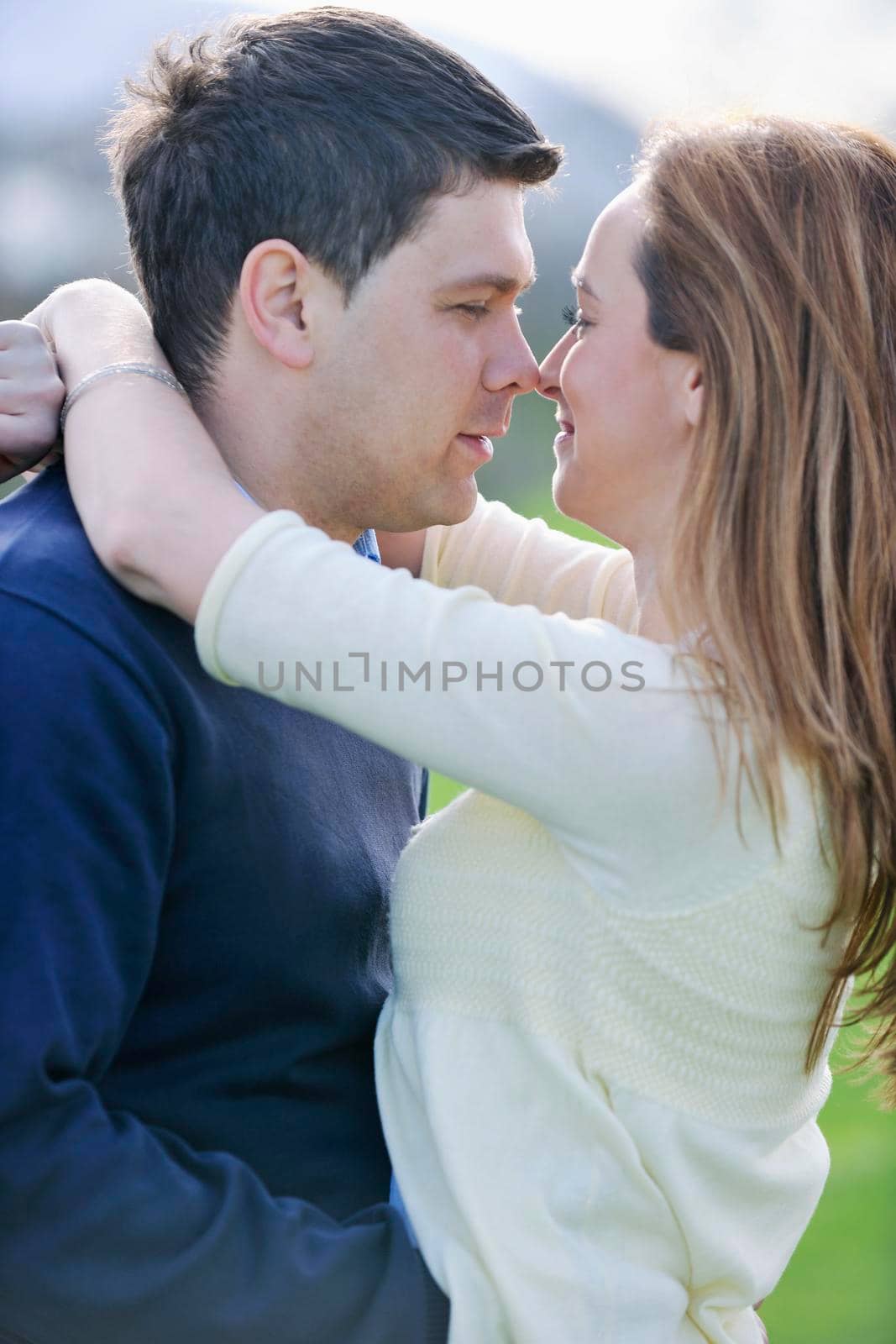 happy young couple have good time and fun outdoor at beautiful sunny day