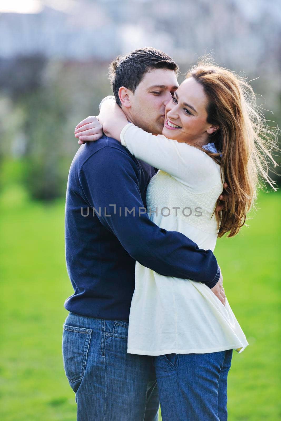 happy young couple have good time and fun outdoor at beautiful sunny day