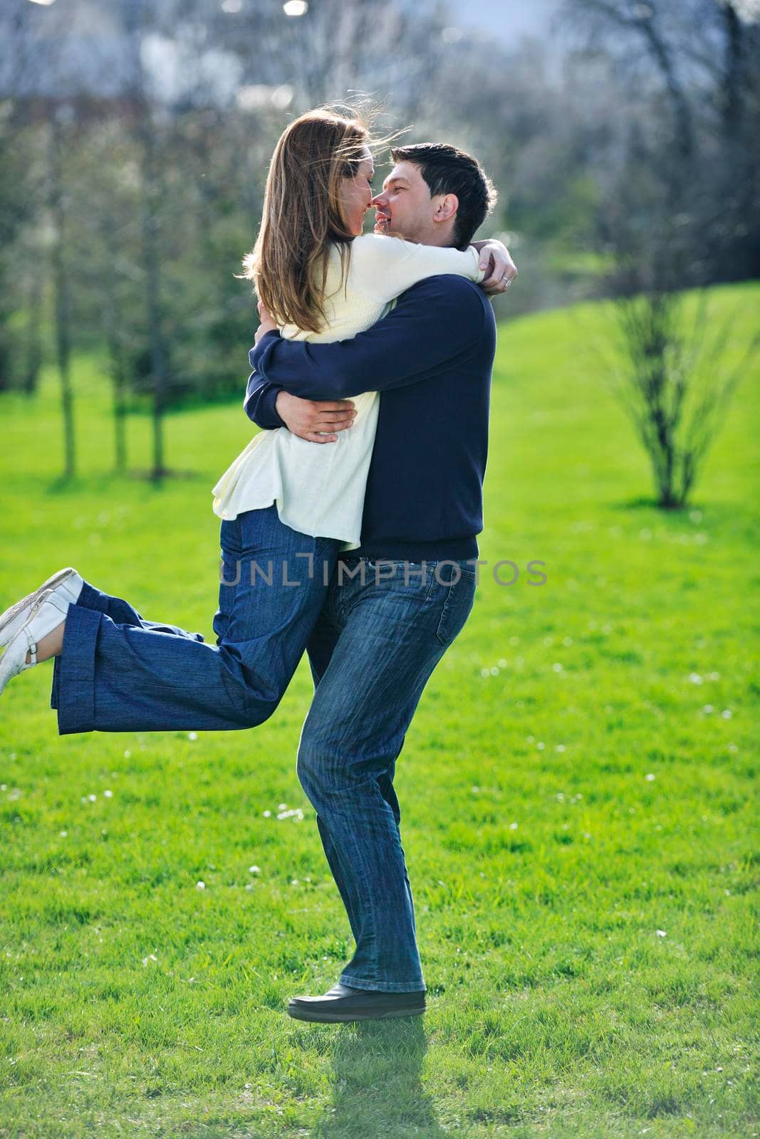 happy young couple have good time and fun outdoor at beautiful sunny day