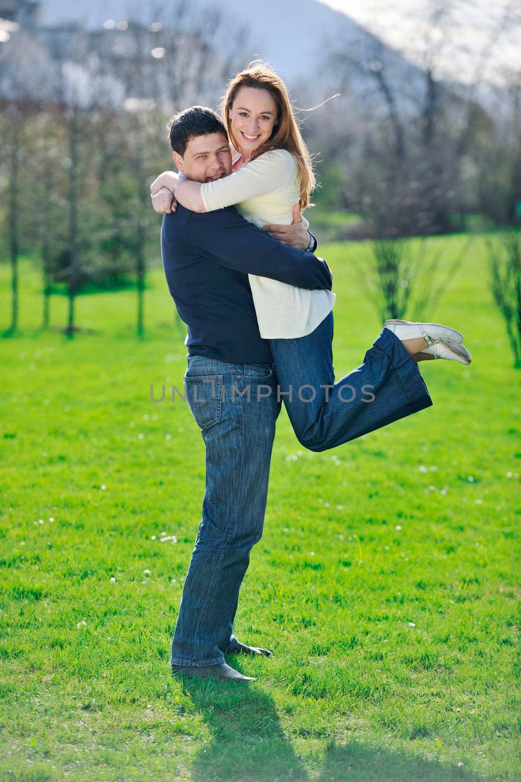 happy young couple have good time and fun outdoor at beautiful sunny day