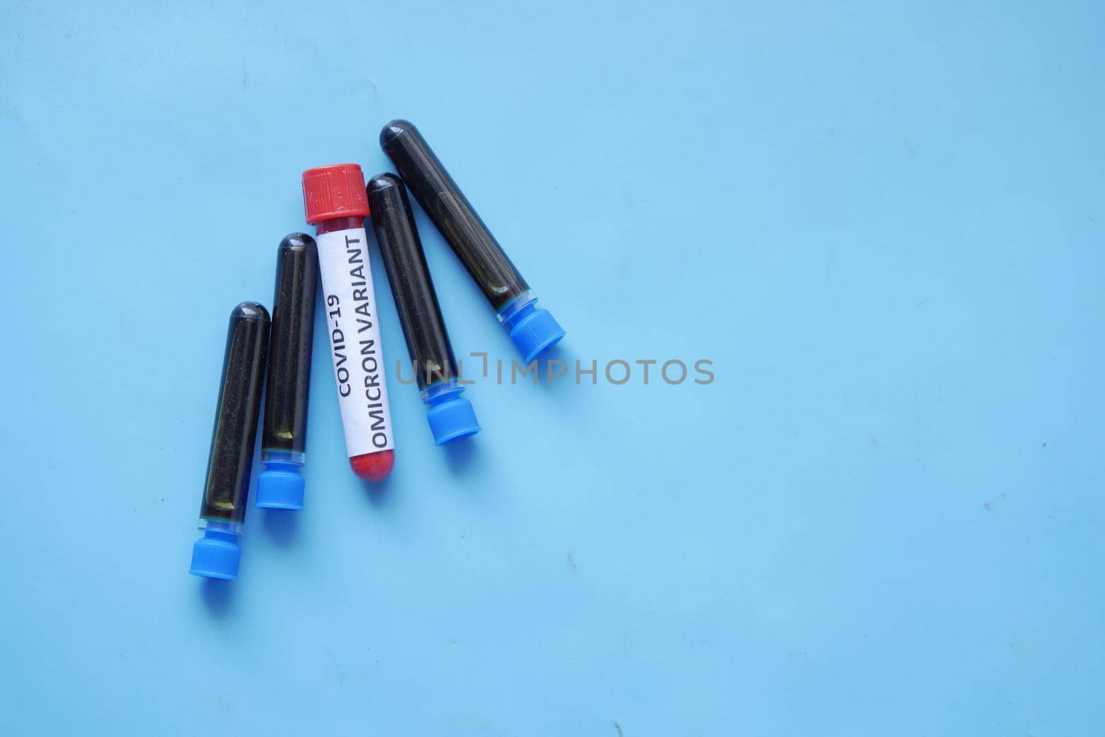 close up of corona virus blood test tube on table .