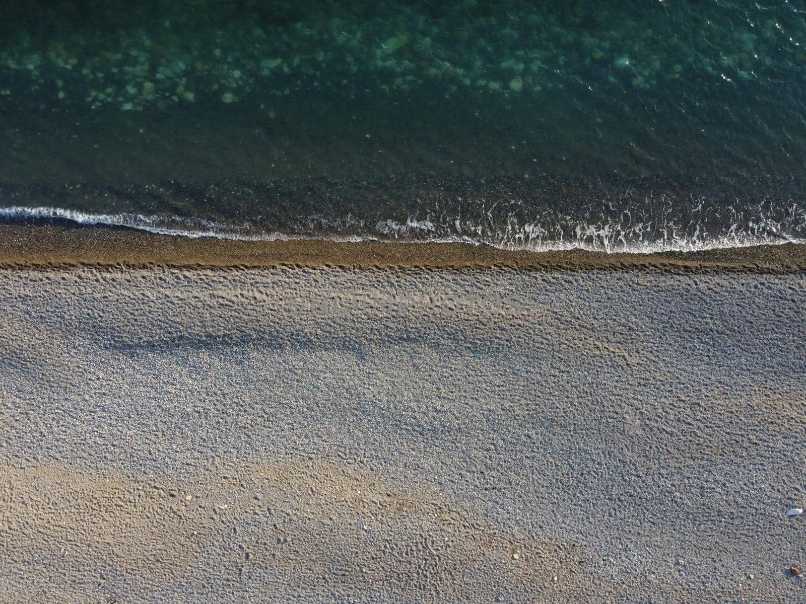 Aerial panoramic view of beautiful sunset above sea. Beautiful seascape. Sun glare, small waves on the water surface. Evening. Horizon. Nobody. No people. Copy space. Never-ending beauty of nature