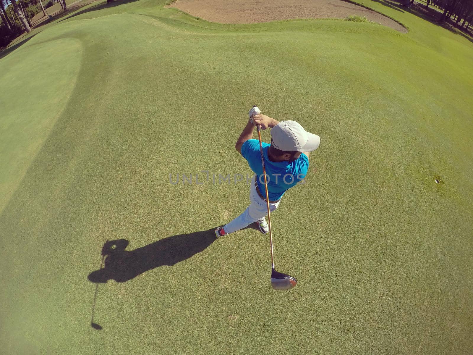 top view of golf player hitting shot by dotshock