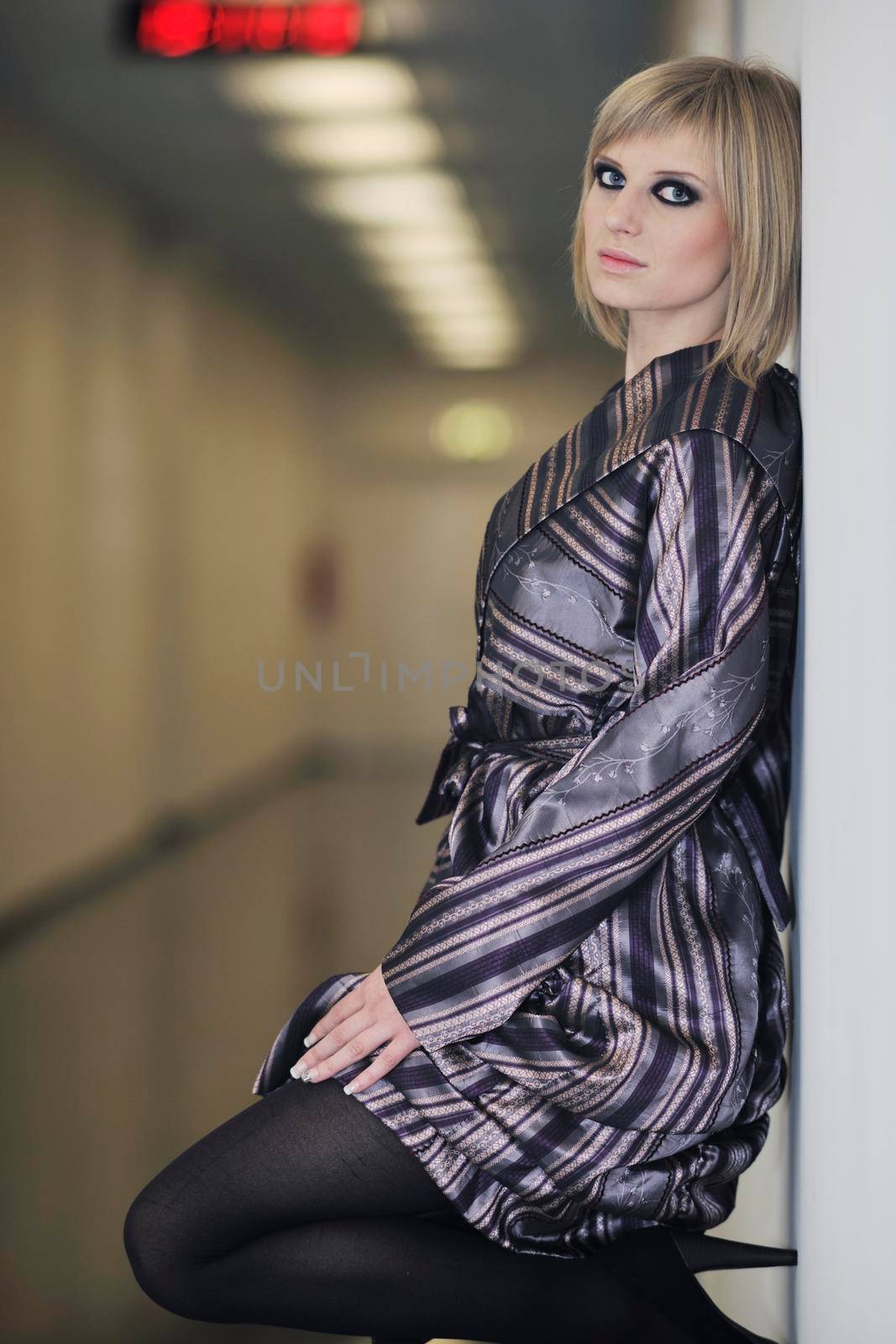 portrait of beautiful young woman with nice hairstyle and fashionable clothing and dress