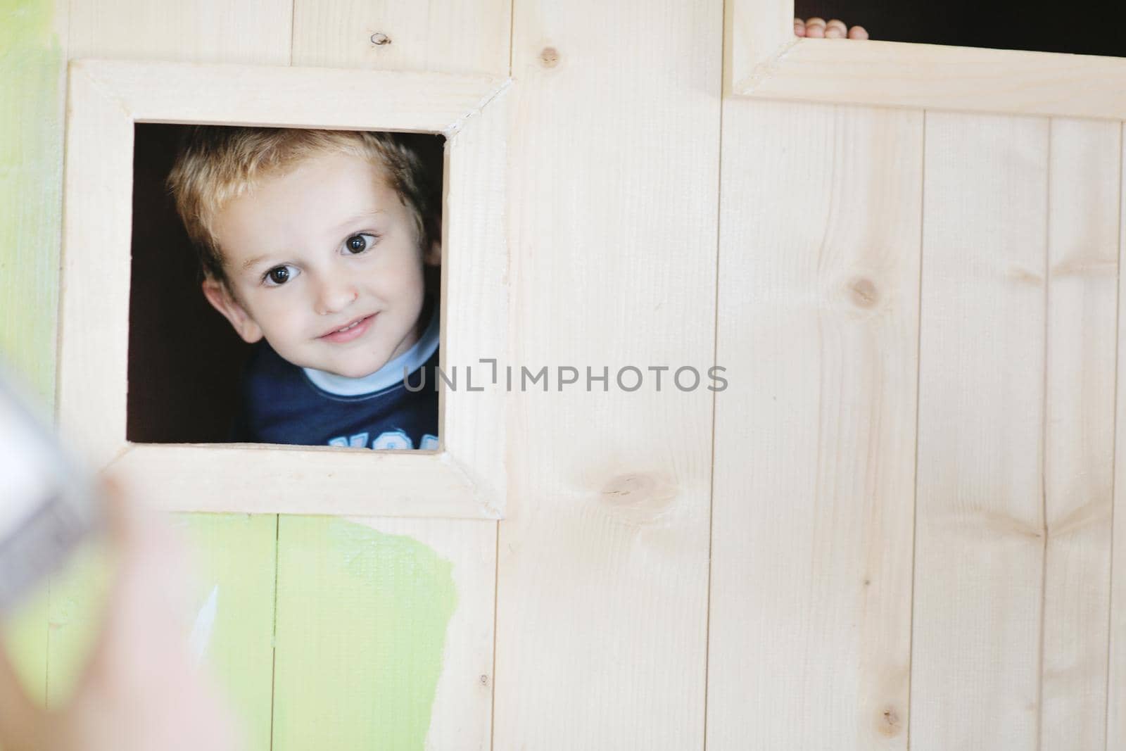 happy child in a window by dotshock