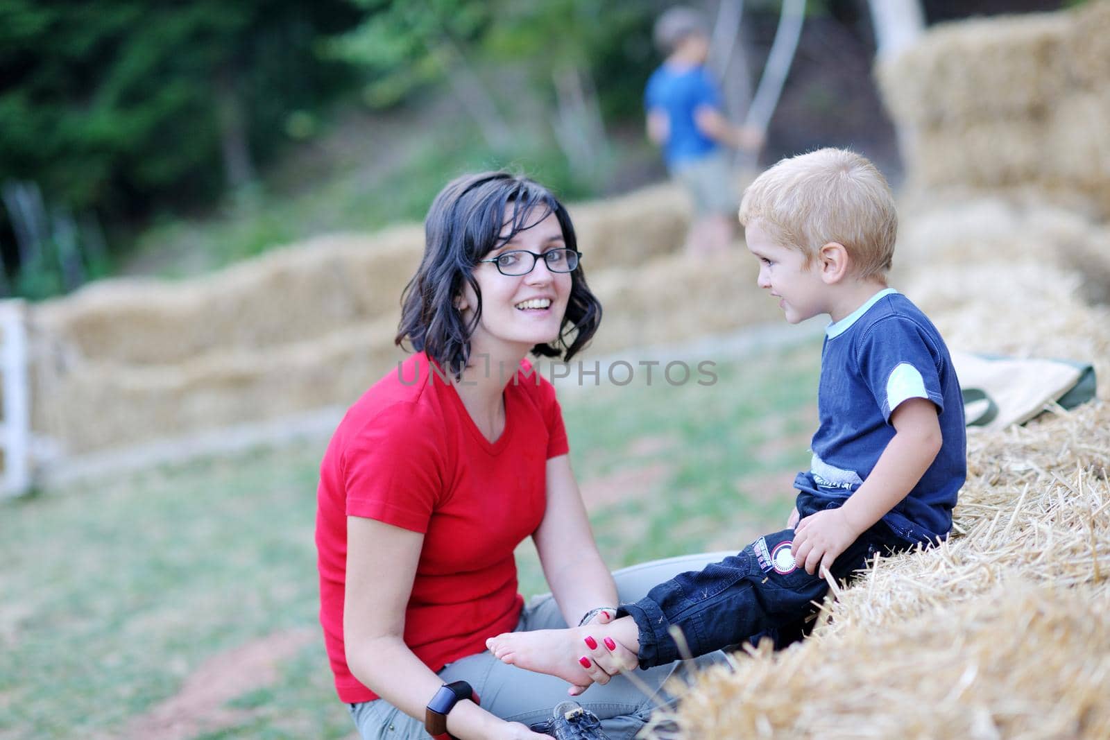 woman and child have fun outdoor at partk in nature