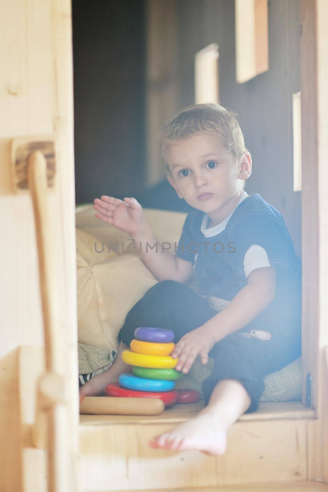 happy little child play game and have fun, education lessons in colorful kinder garden playground indoors