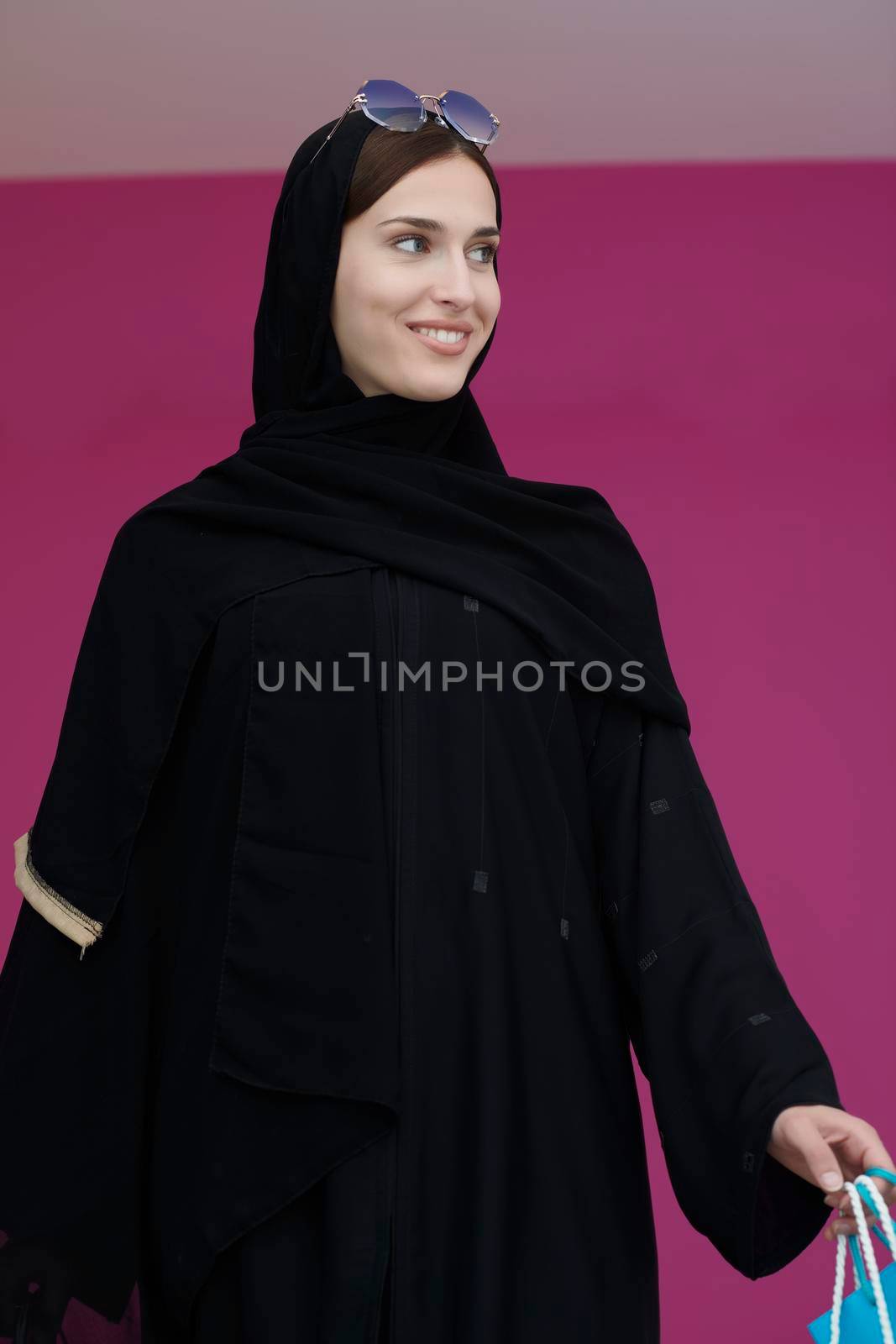 Happy muslim girl posing with shopping bags by dotshock