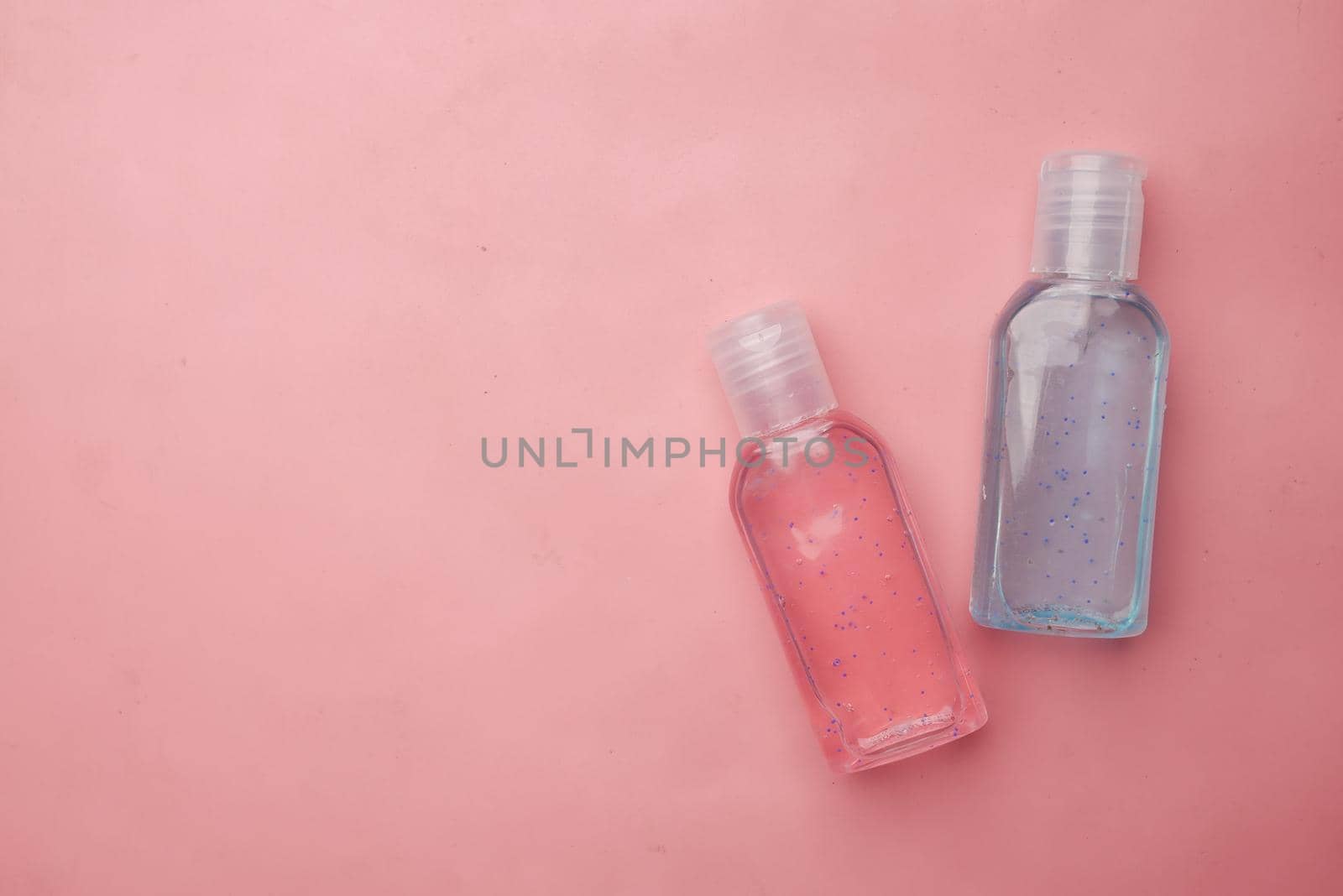 many hand wash in a container on table .