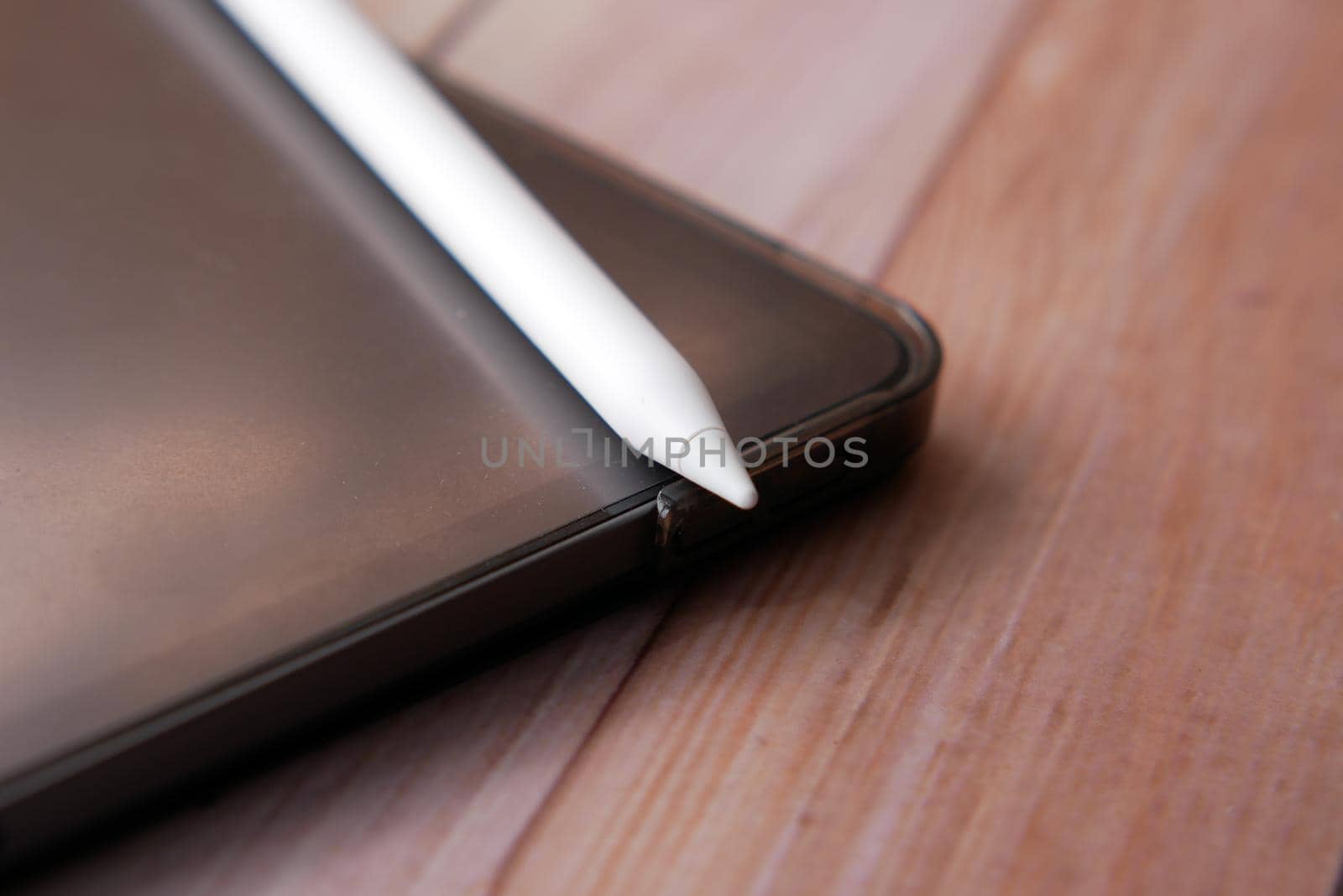 digital tablet and graphic on table .