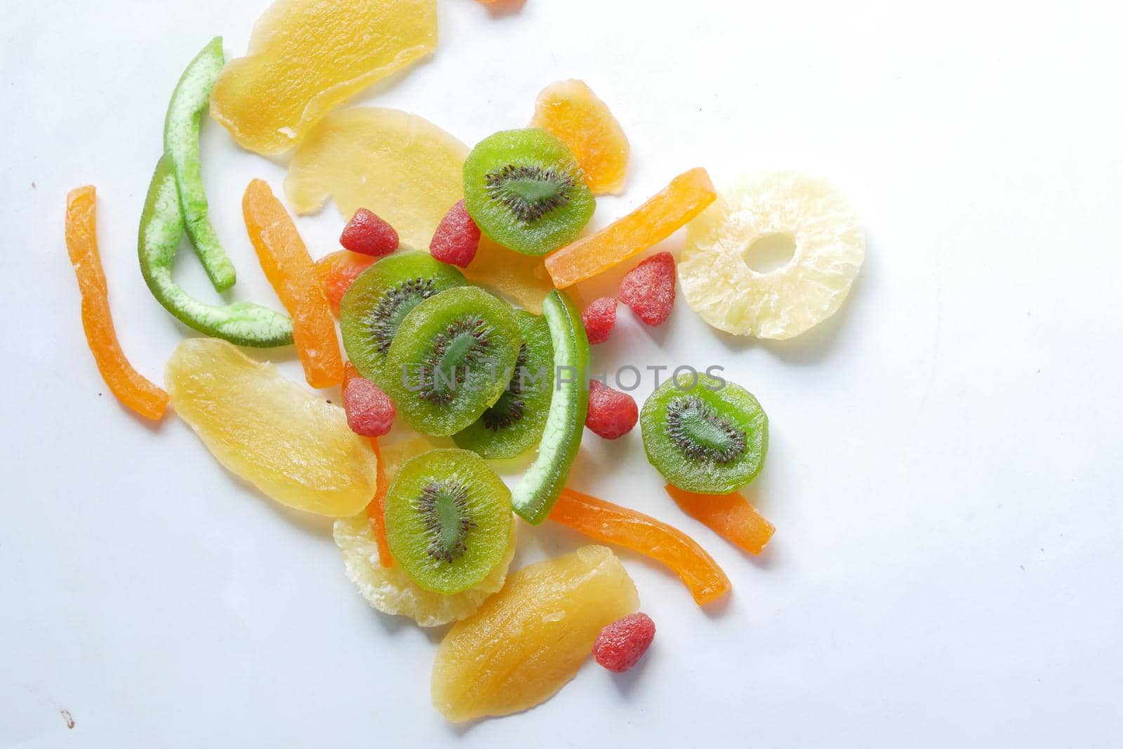 Dried fruits and berries on blue background .