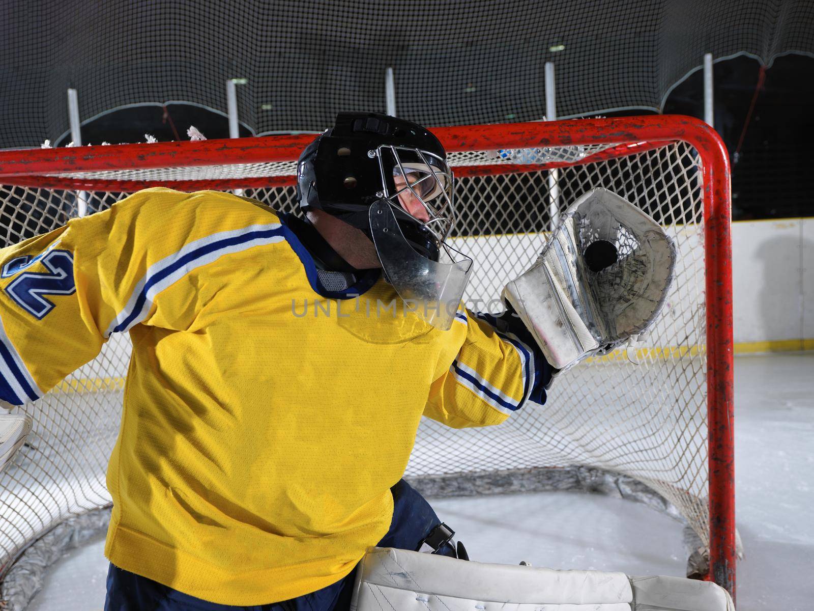 ice hockey goalkeeper  player on goal in action