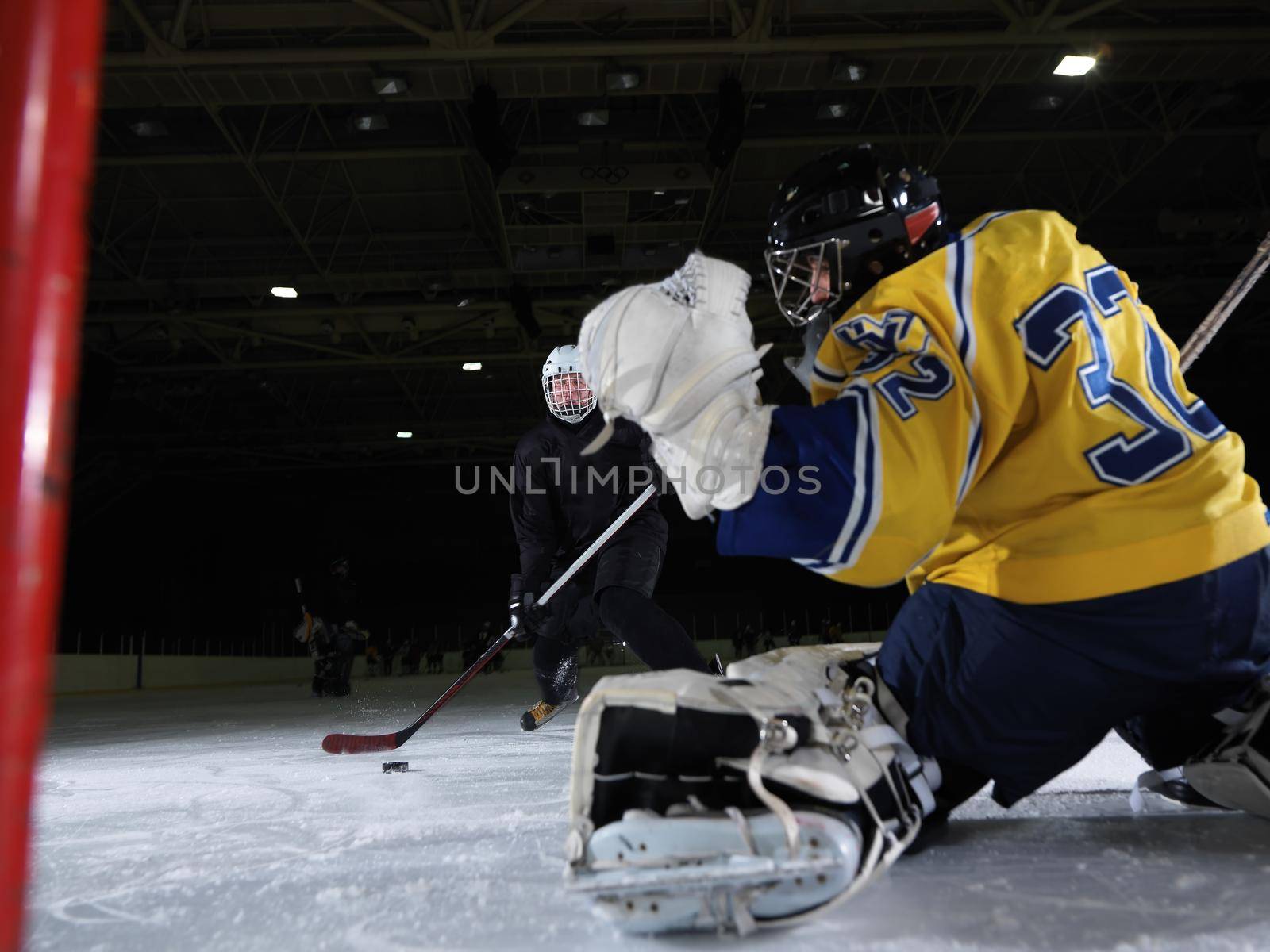 ice hockey goalkeeper  player on goal in action