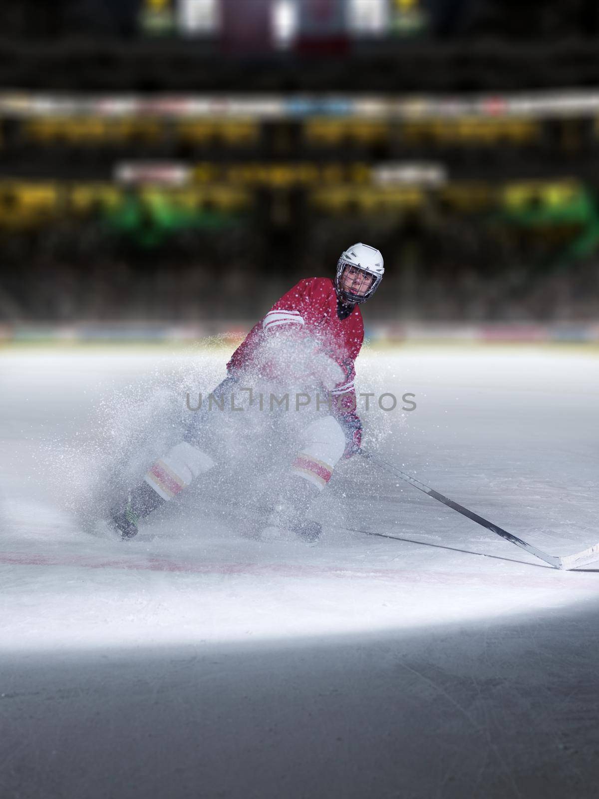 ice hockey player in action kicking with stick