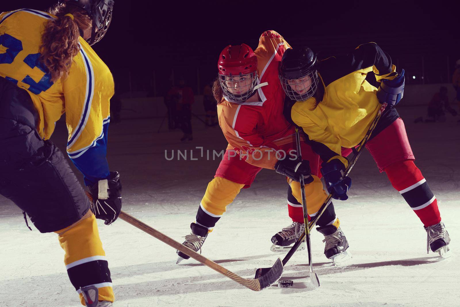 teen ice hockey sport  players in action by dotshock