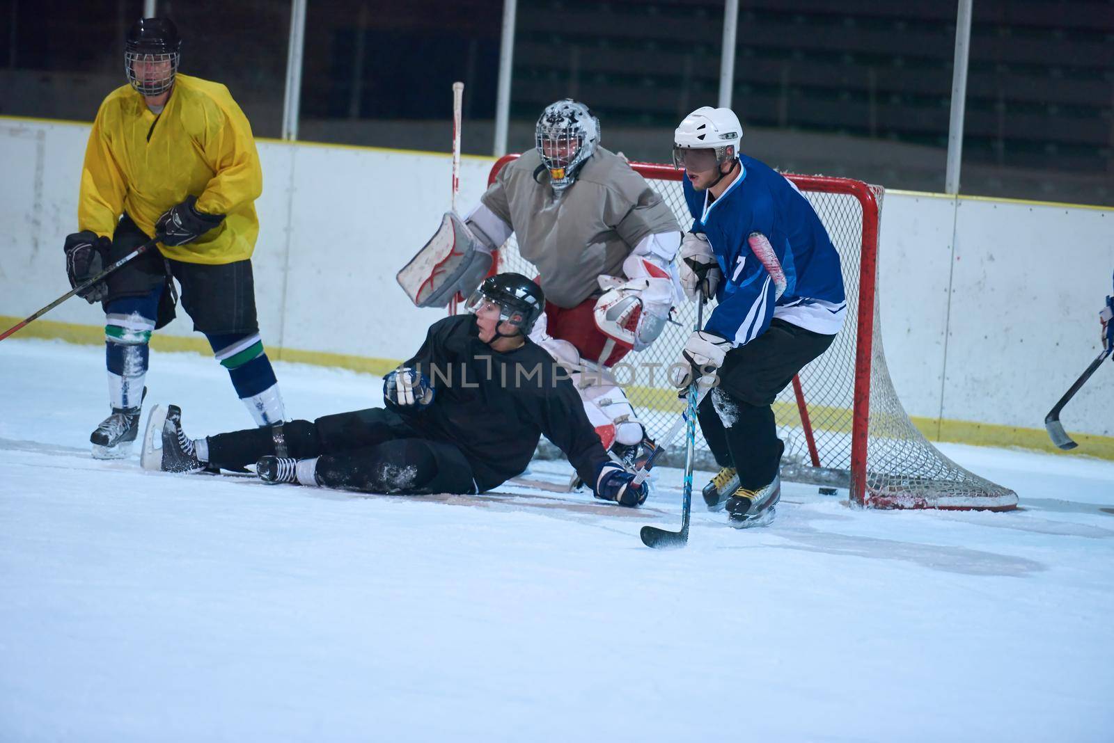 ice hockey goalkeeper  player on goal in action