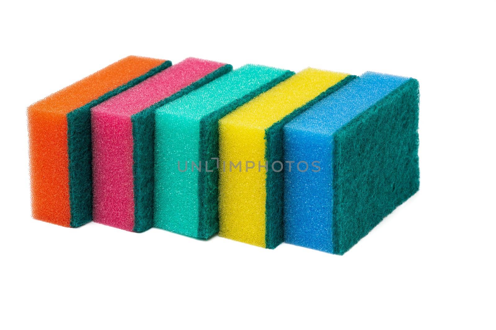 Group of foam sponges with abrasive material used by housewives who care about cleanliness in their favorite kitchen. Five orange, pink, green, yellow and blue colors sponges on white background