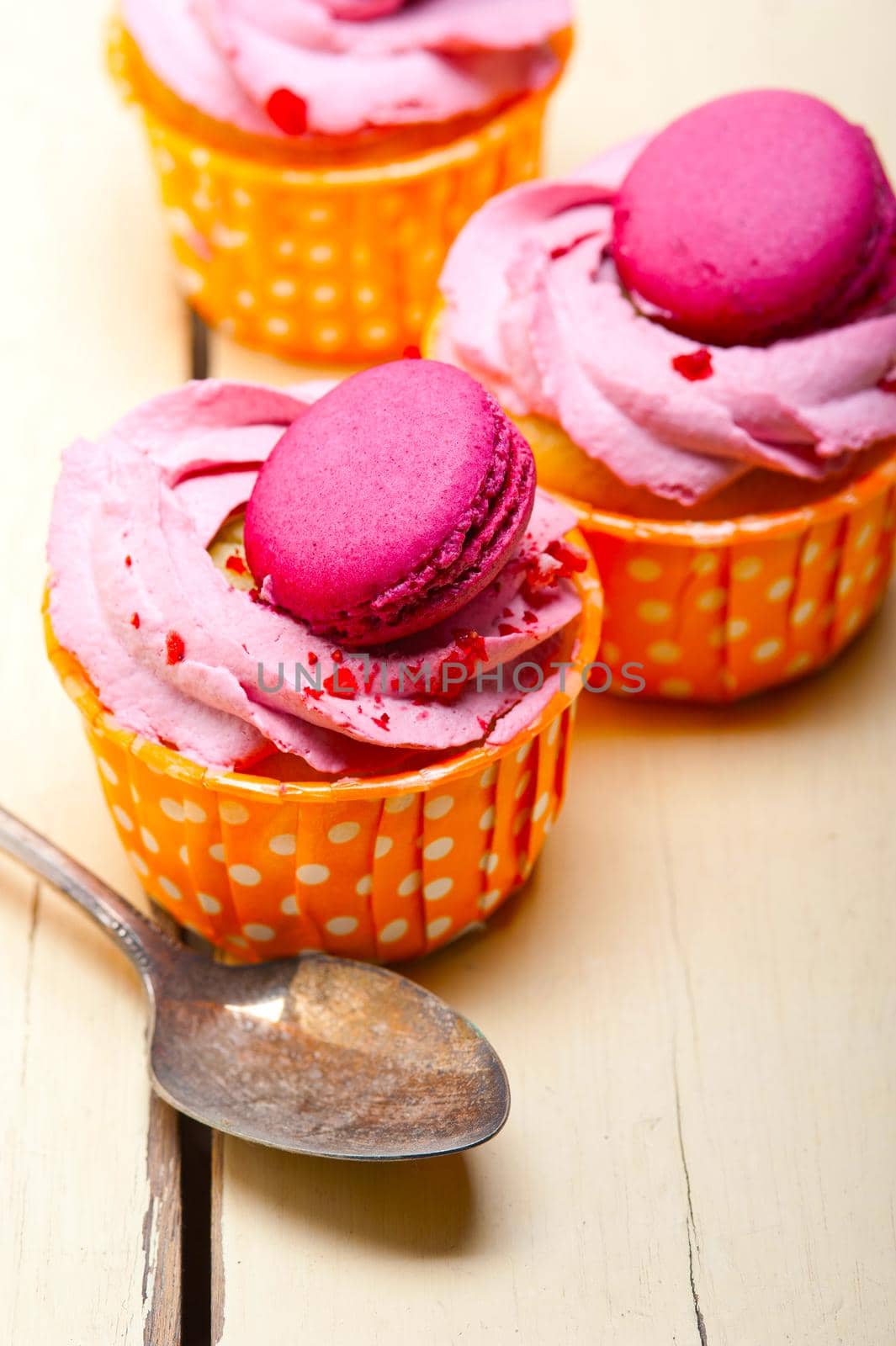 pink berry cream cupcake with macaroon on top by keko64