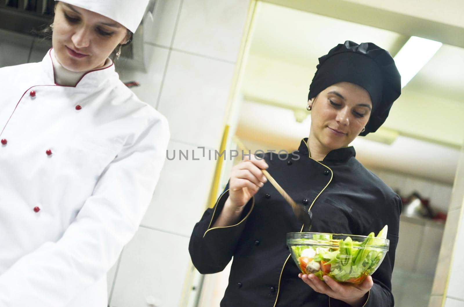 beautiful young chef woman prepare and decorating tasty food in kitchen