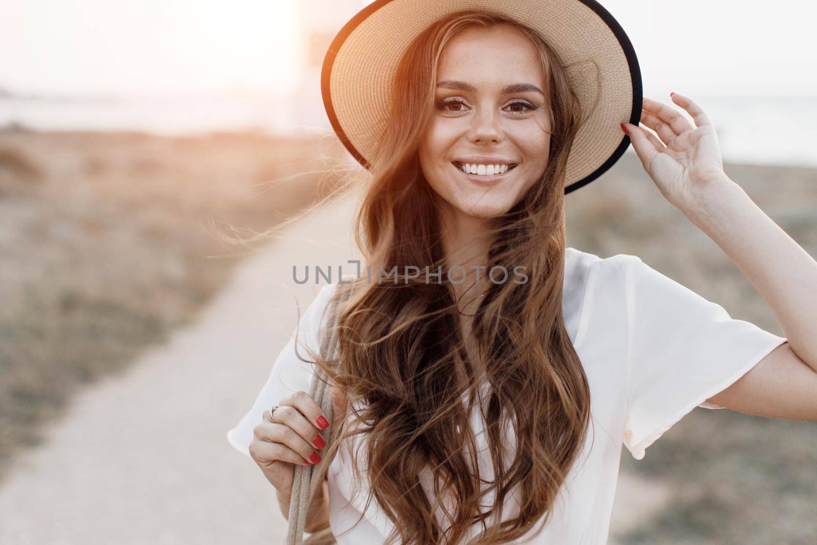 Young happy woman in hat outdoor. High quality photo