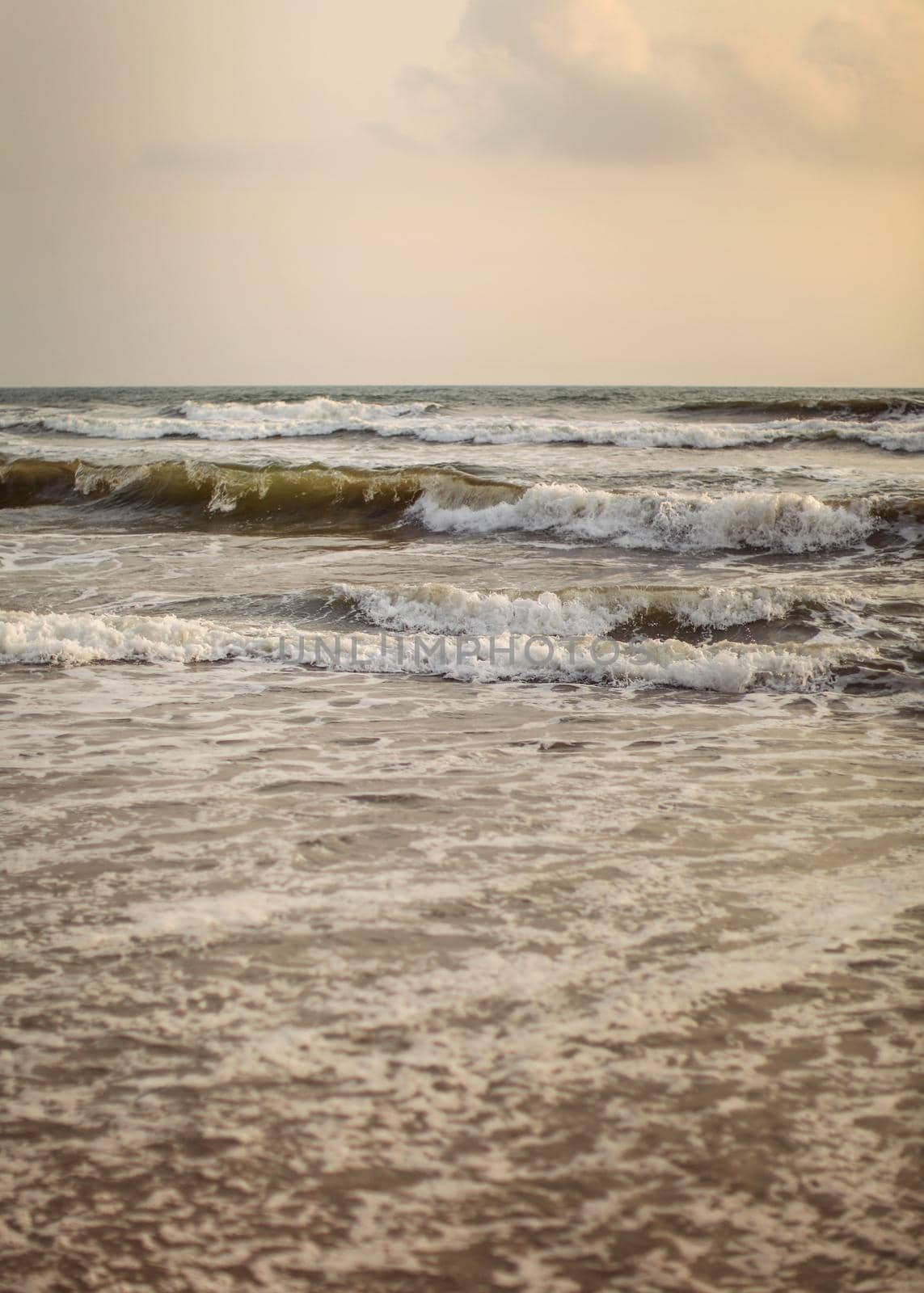 Detail on sea waves in evening light, just after sunset. by Ivanko