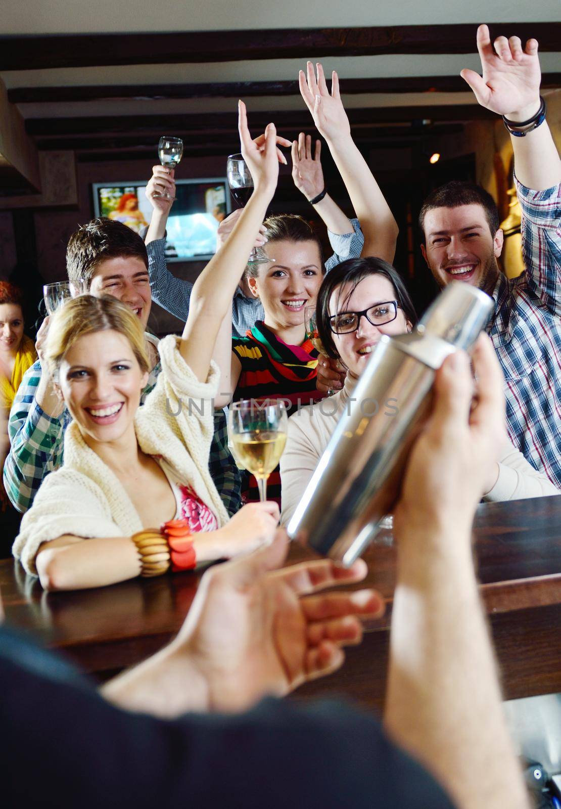 Group of happy young people drink wine  at party disco restaurant