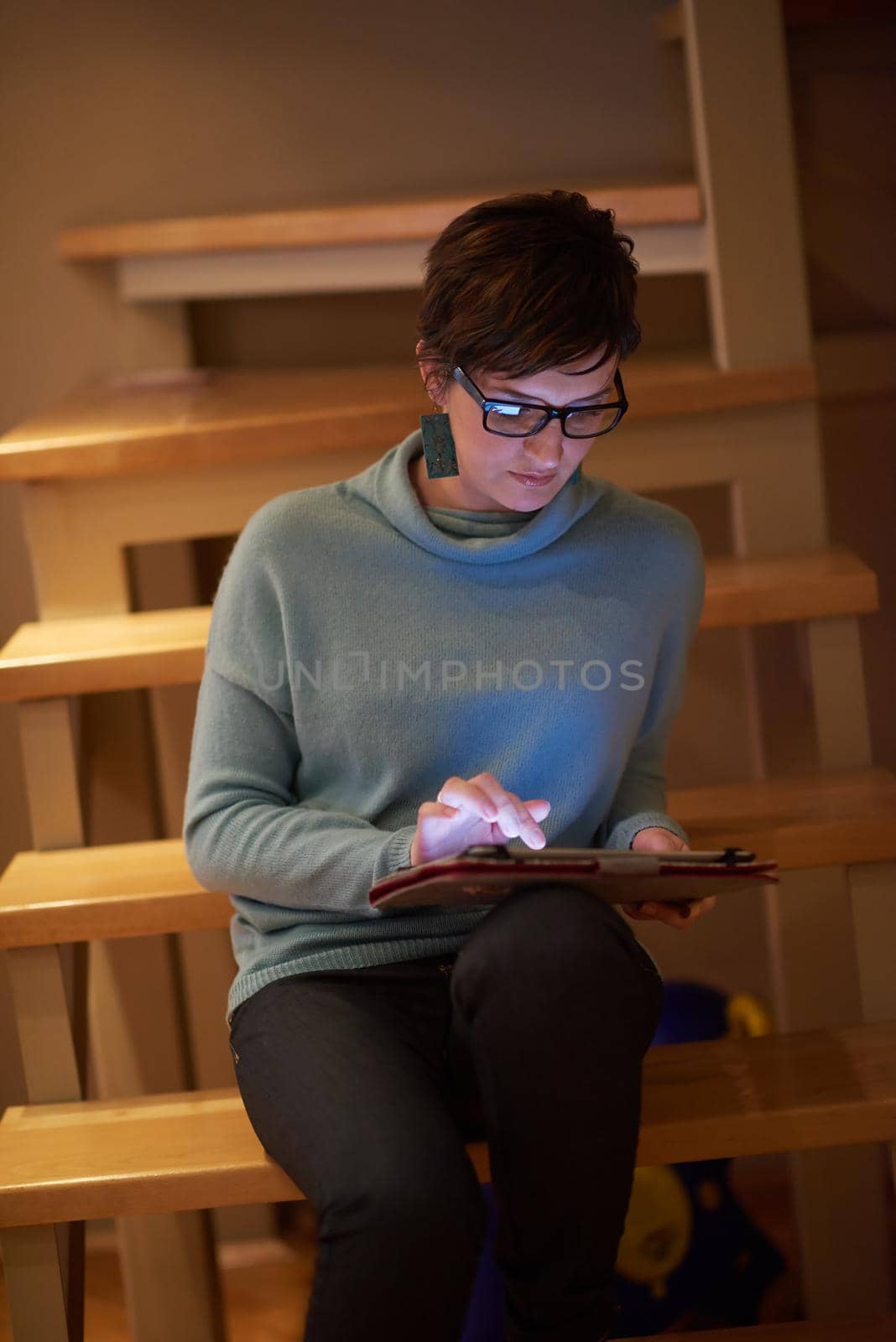 woman at home using tablet computer