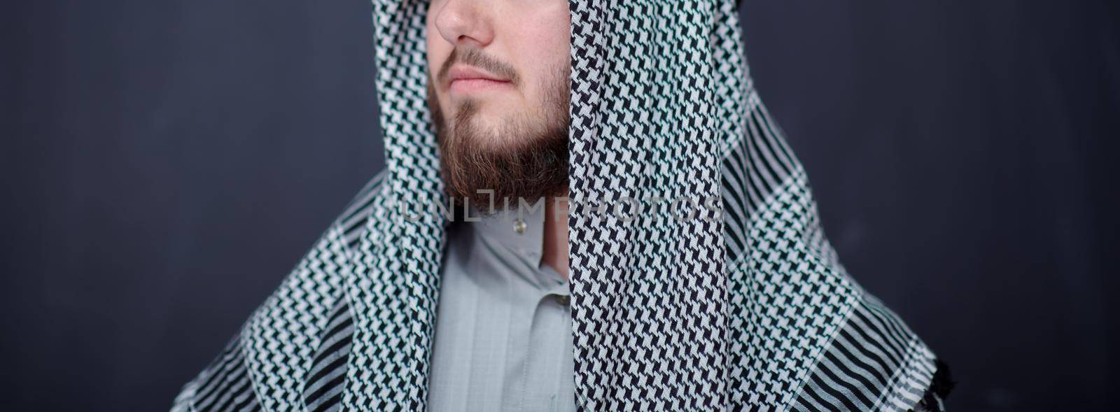 portrait of arabian man in front of black chalkboard by dotshock