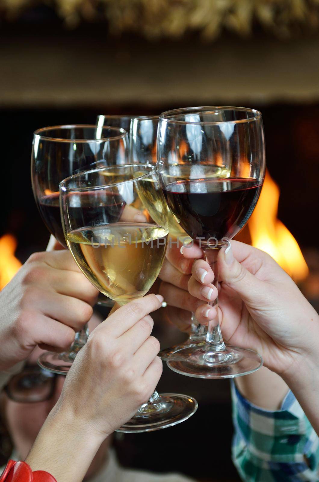 Group of happy young people drink wine  at party disco restaurant