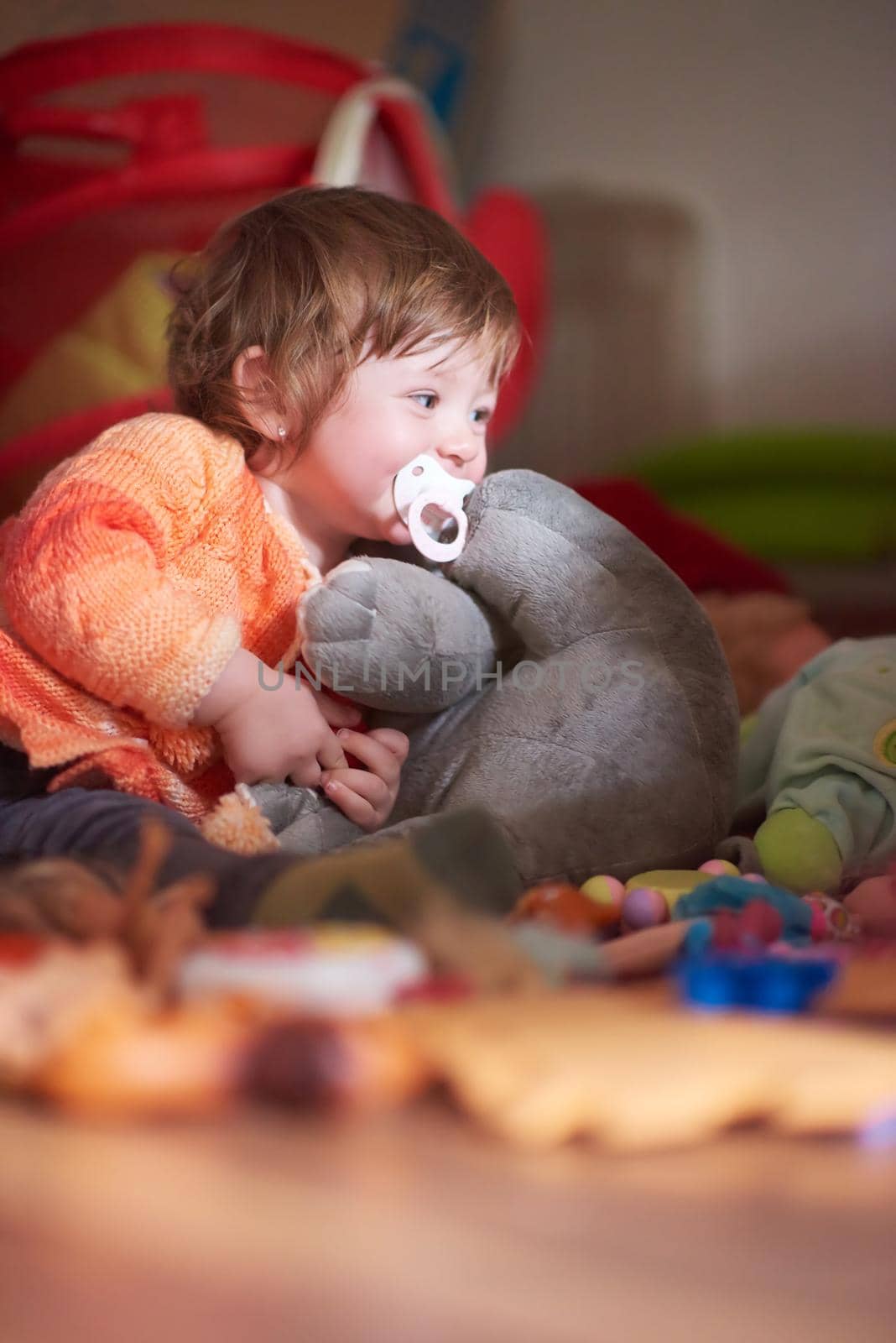 child playing with toys  at home by dotshock