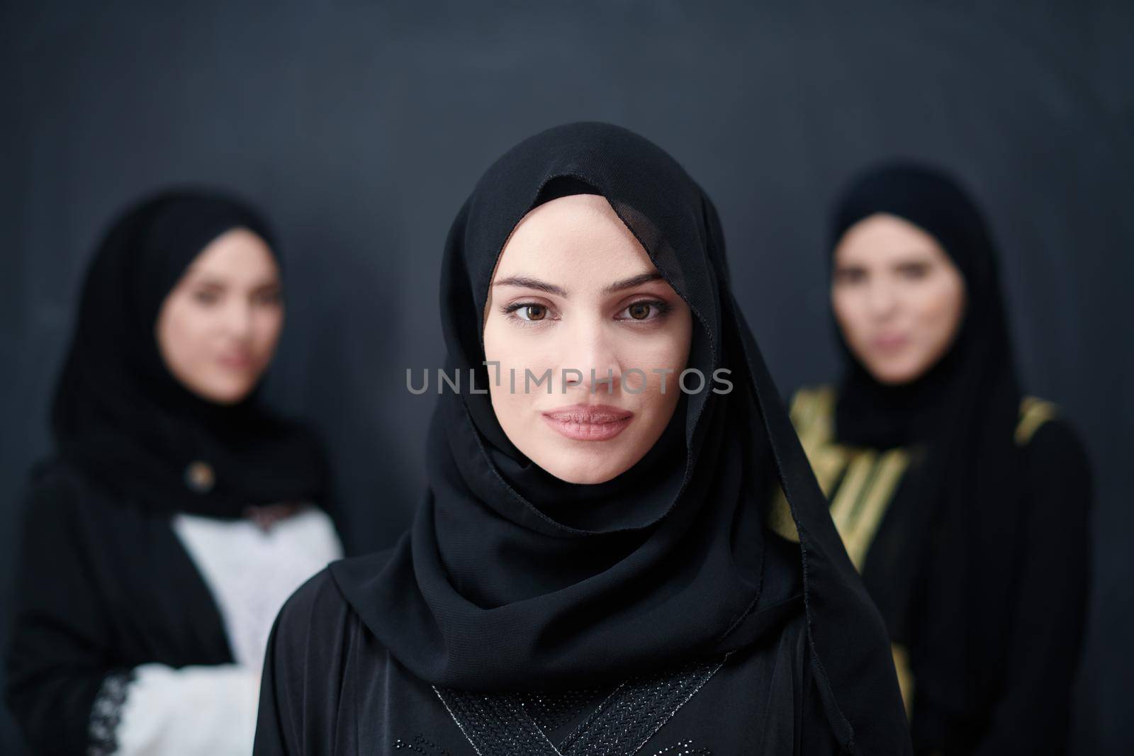portrait of beautiful muslim women in fashionable dress by dotshock