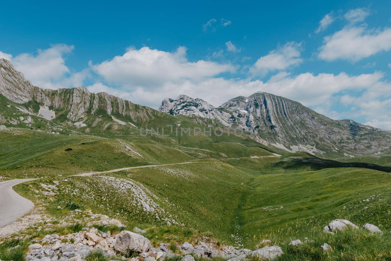 Mountain valley during sunrise. Natural summer landscape. Mountain peak green nature scenery. trail on green hill landscape