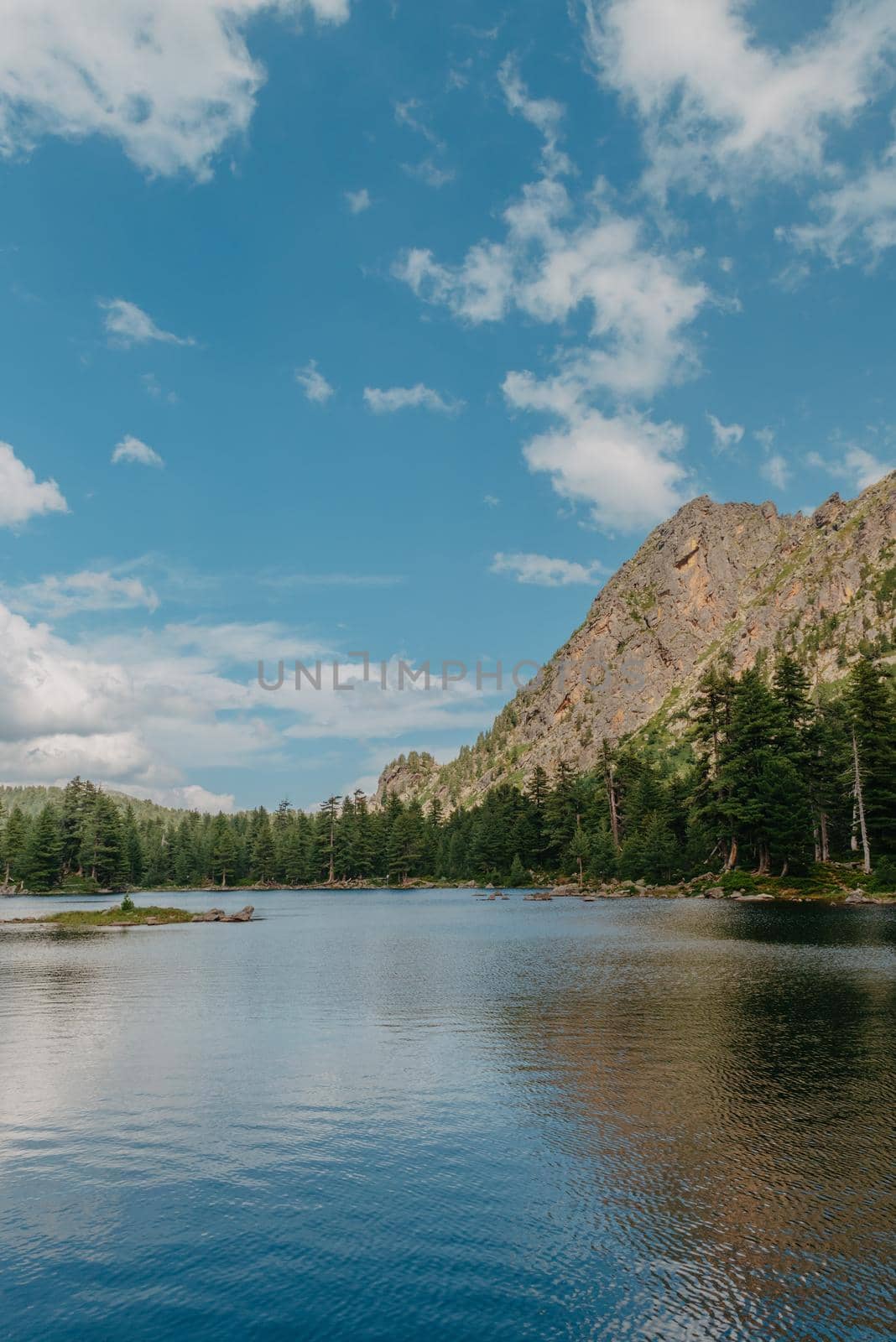 Majestic mountain lake. scenery of high mountain with lake and high peak by Andrii_Ko