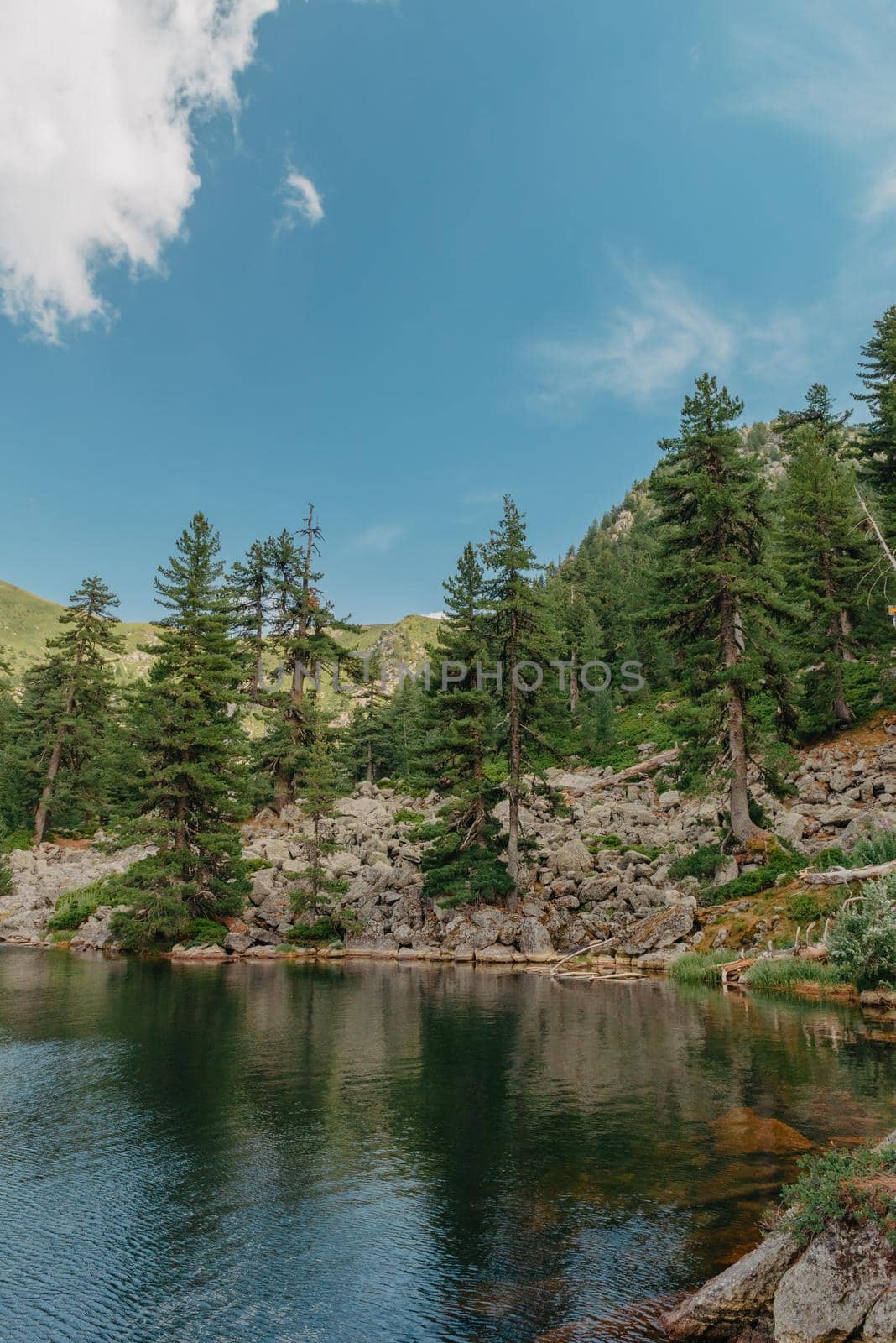 Majestic mountain lake. scenery of high mountain with lake and high peak by Andrii_Ko