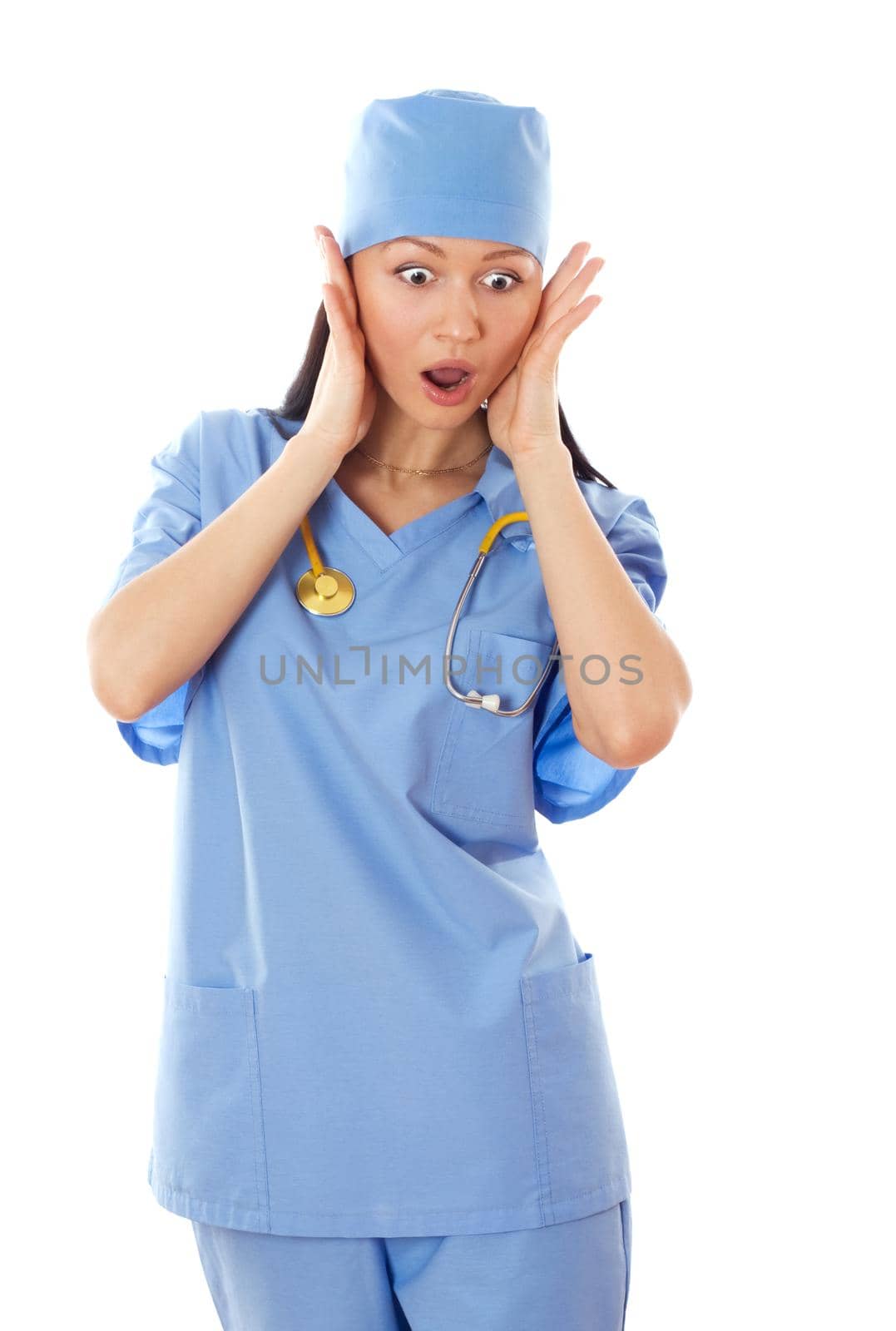 Full isolated studio picture from a young female doctor looking scared.