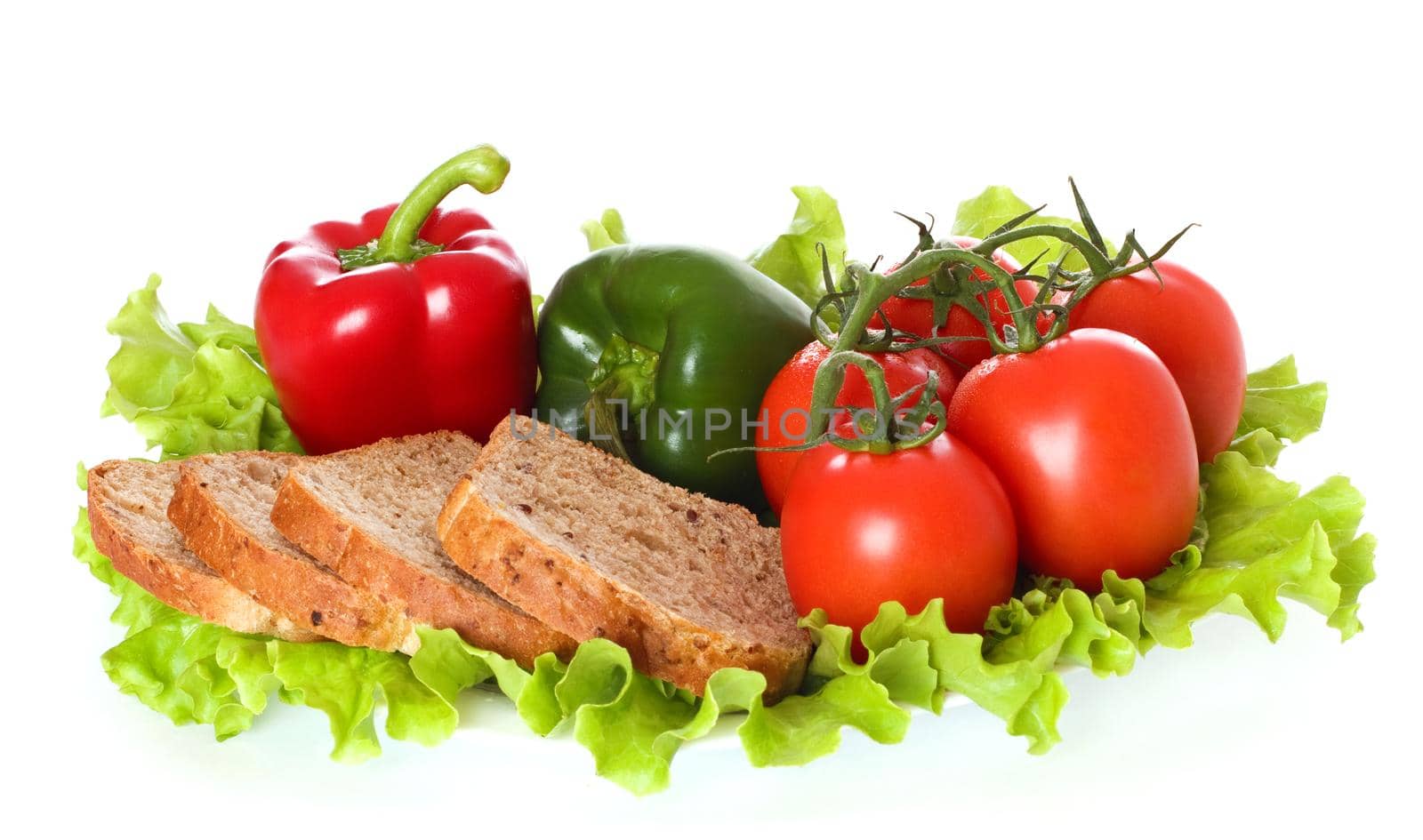 Fresh vegetables and bread on plate, isolated on white background.