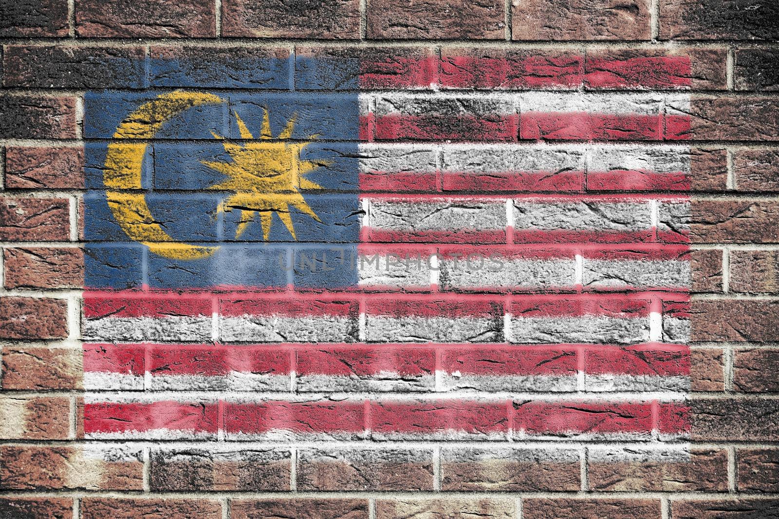 A Malaysia flag on old brick wall background
