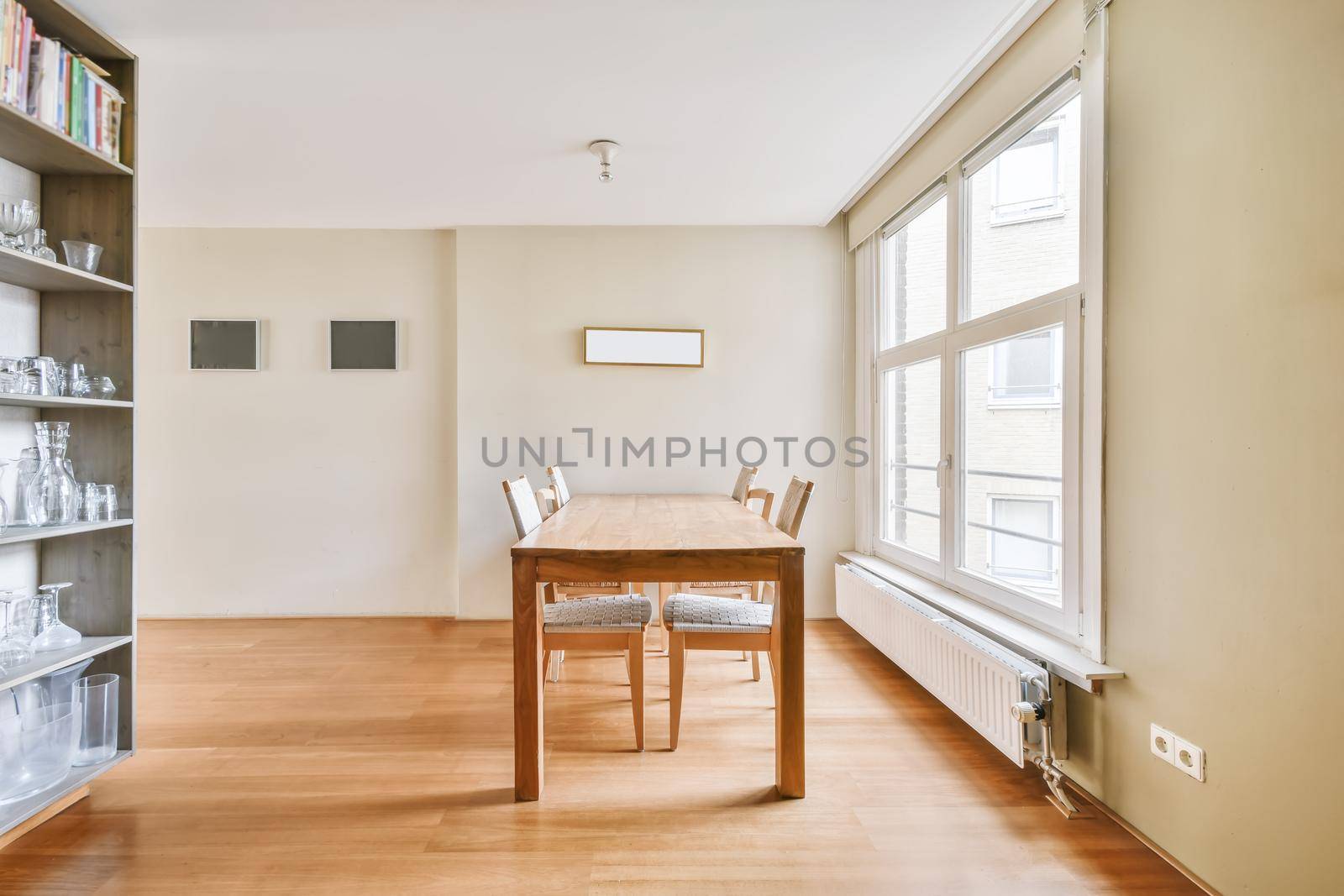 Pretty bright dining room with a four-seater wooden table