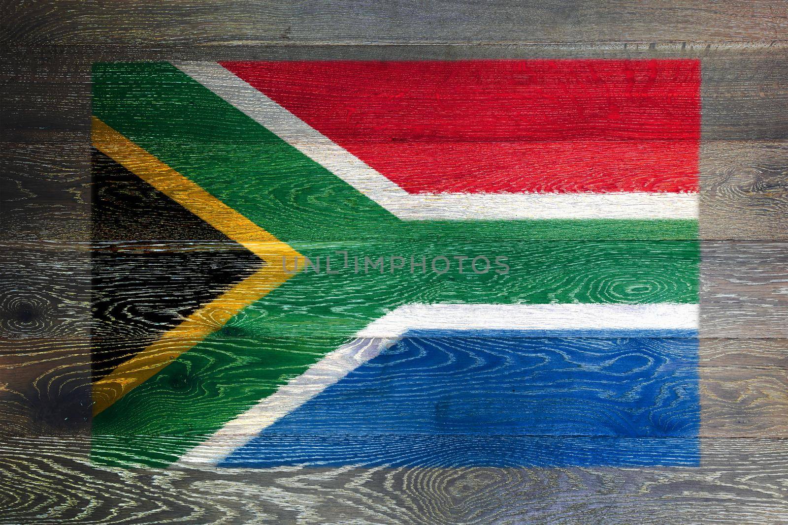 A South Africa flag on rustic old wood surface background