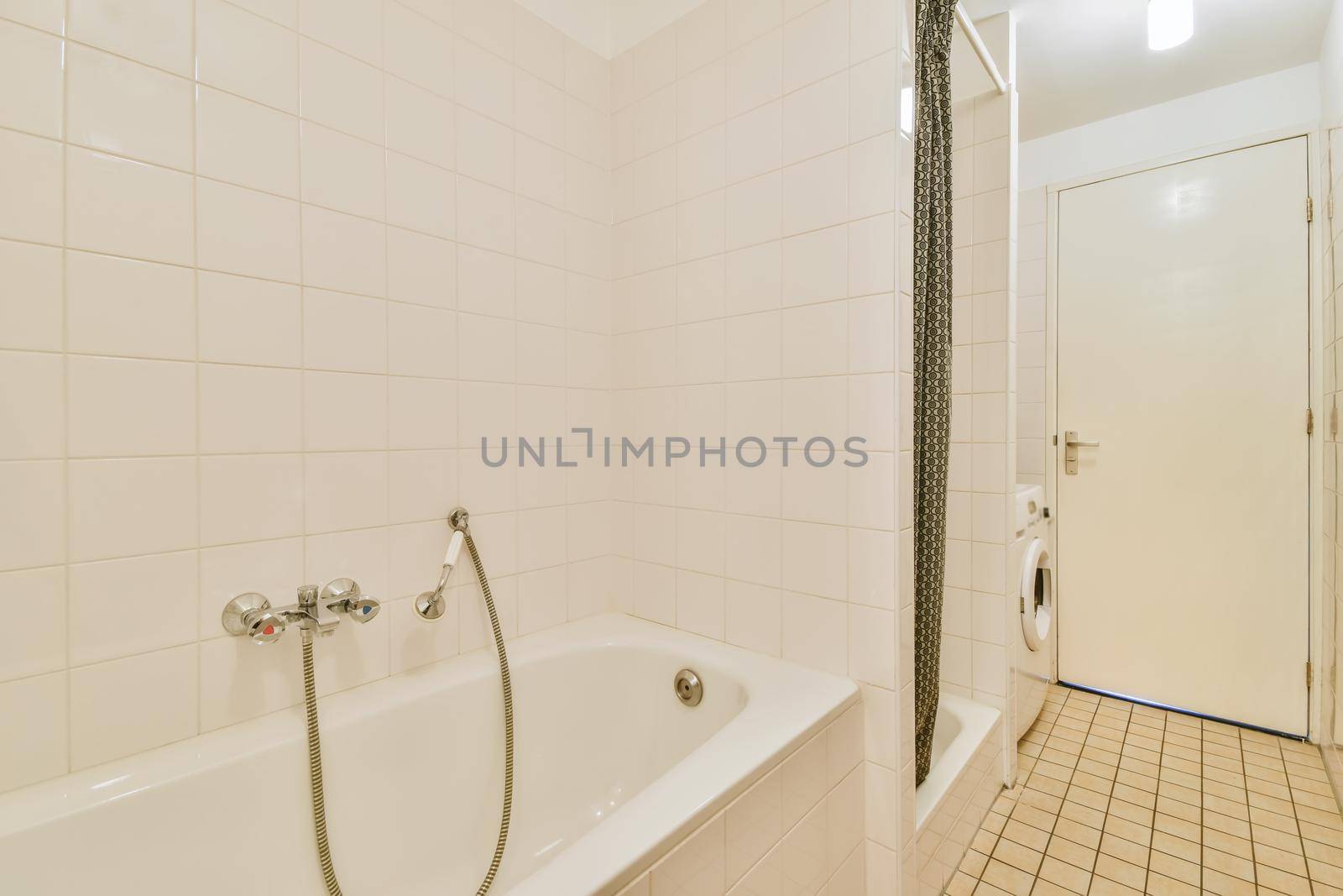 Interior design of bright cozy bathroom with bathtub